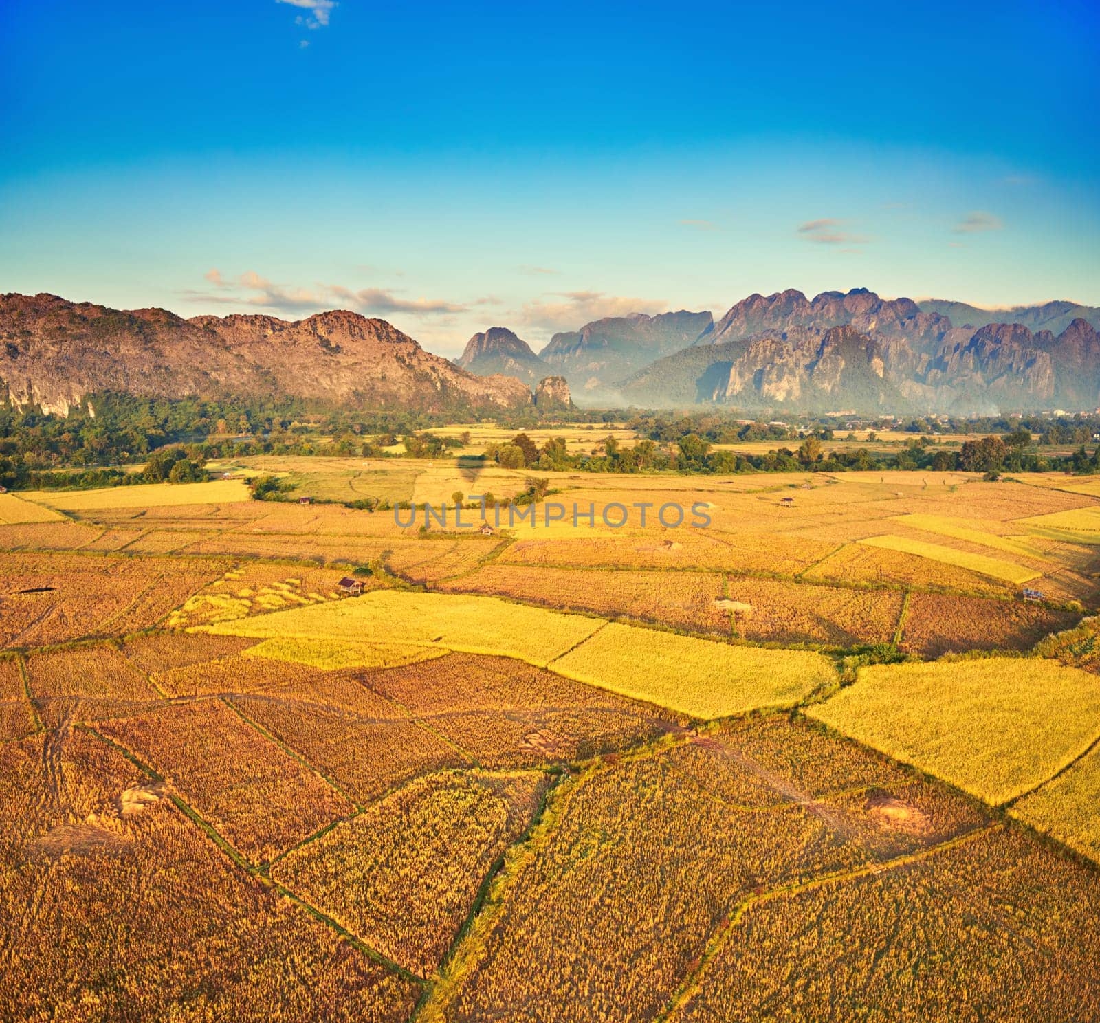 Aerial view of the fields and mountain. Beautiful landscape. Vang Vieng. Laos.