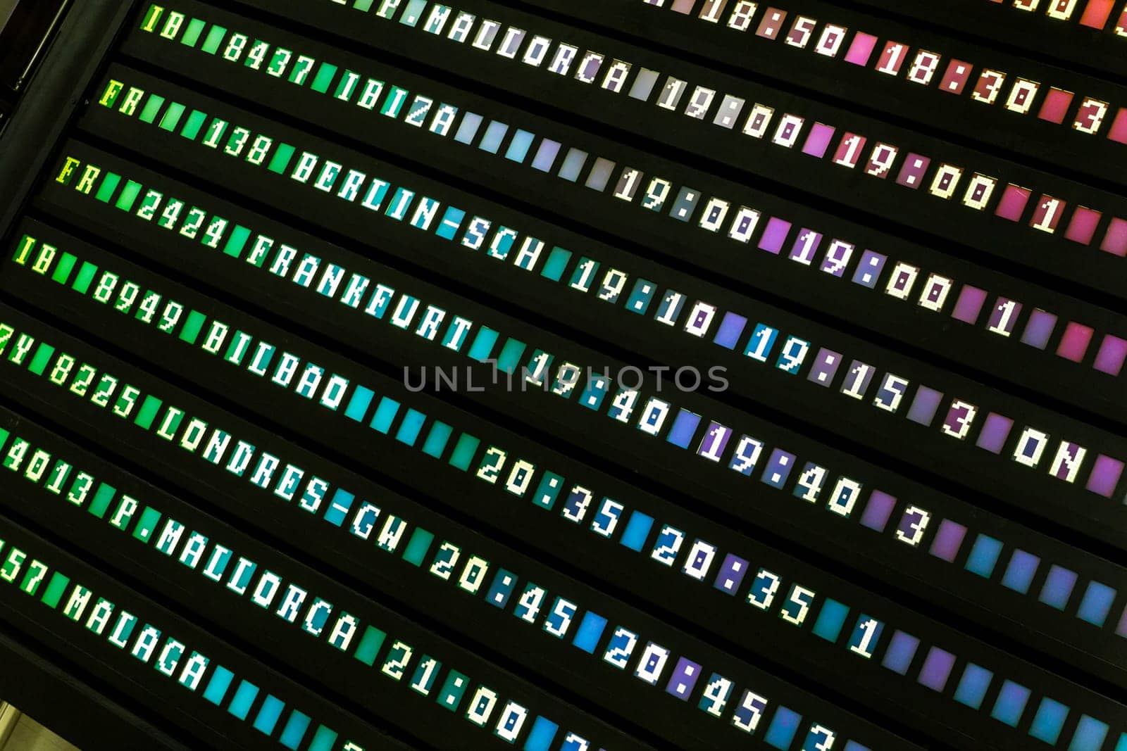 Colorful electronic airport departures or arivals board.