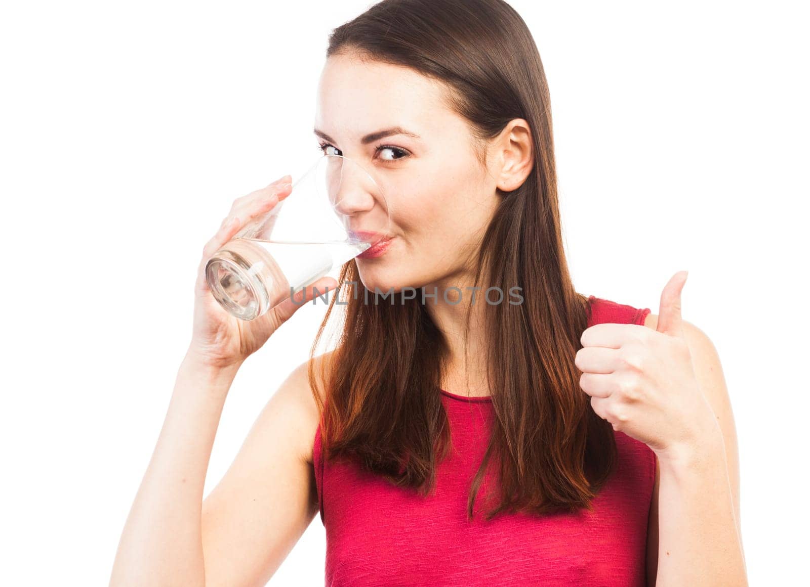 Portrait of a smiling woman drinking a glass of water, health concept, isolated on white