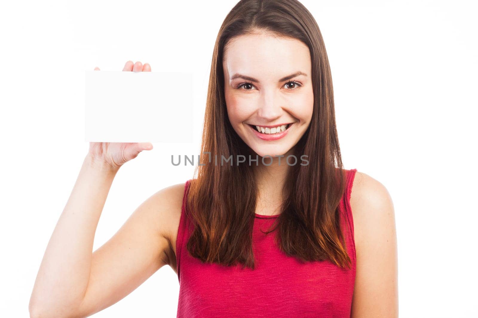 Young brunette showing a blank business card, isolated on white