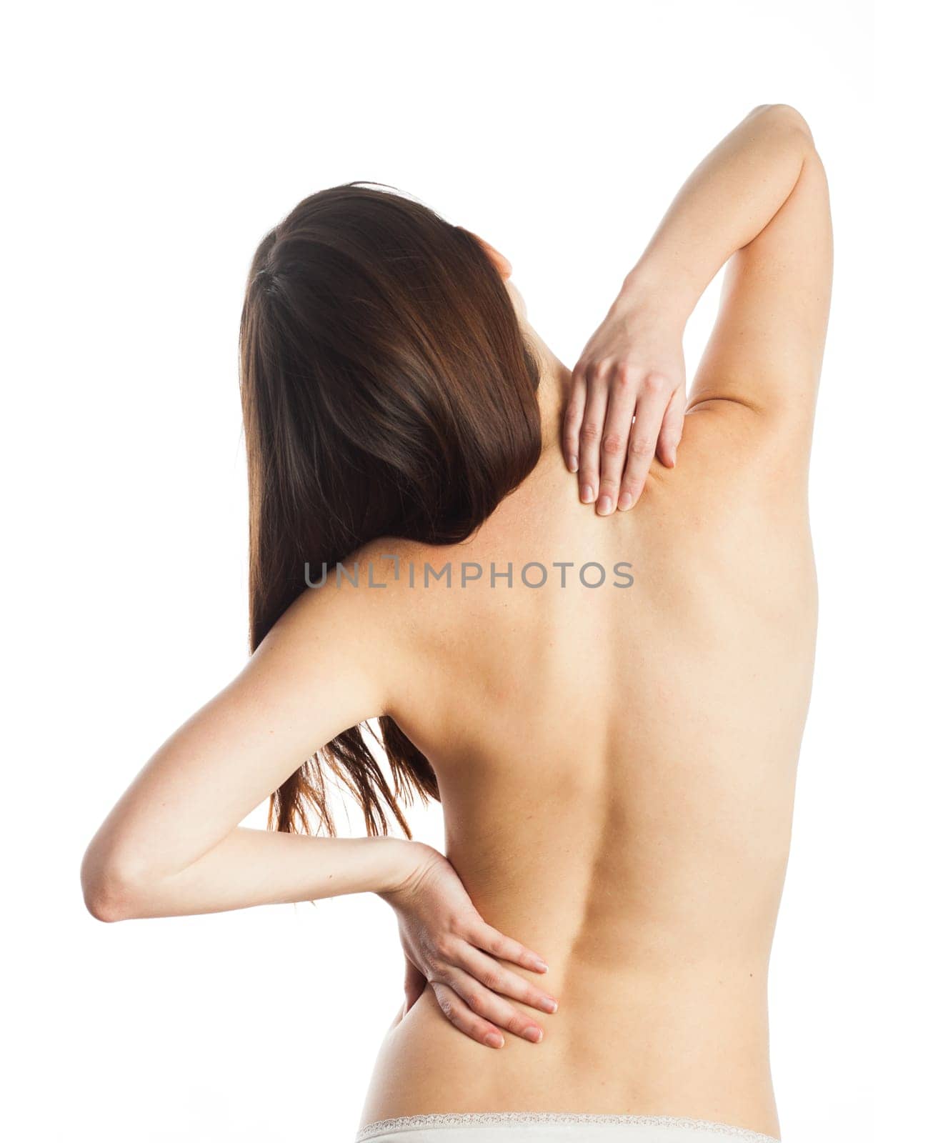 Young woman feeling pain on her back, isolated on white