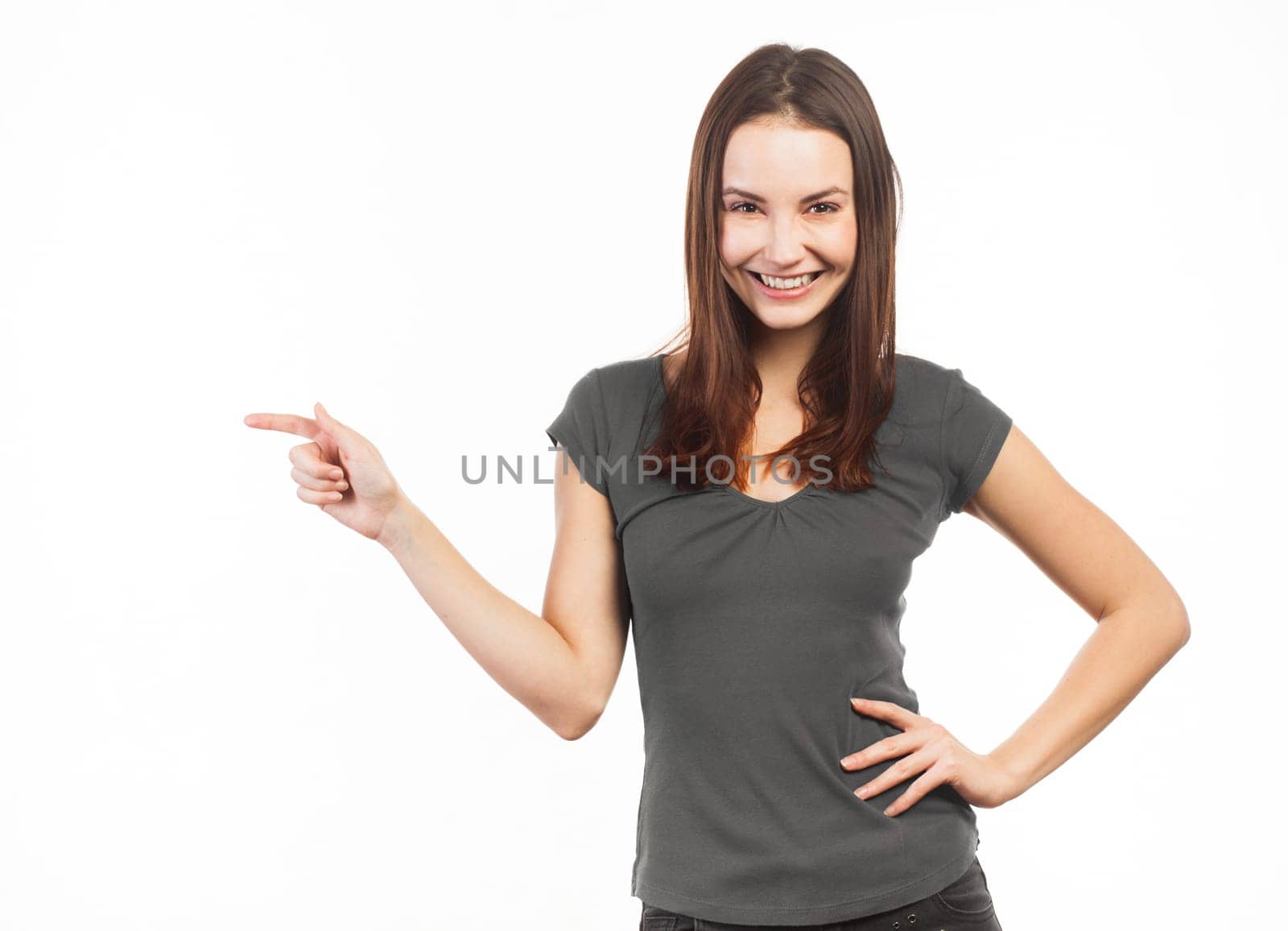 Cheerful woman pointing at copy space, isolated on white
