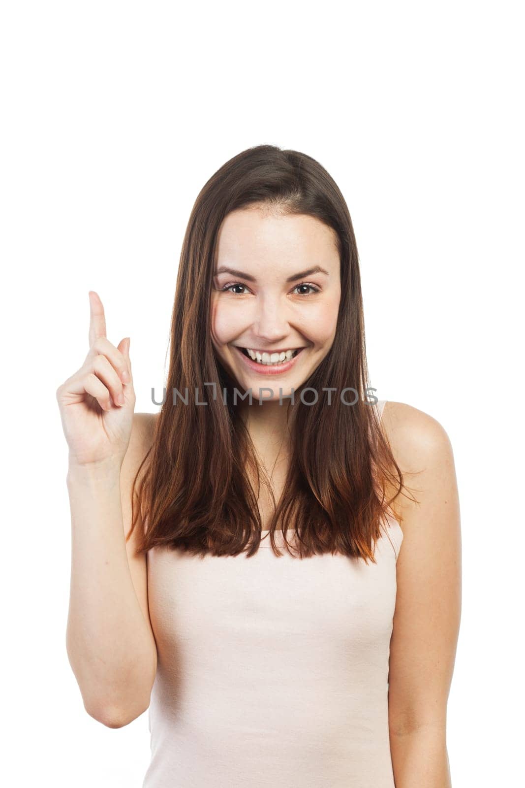 Cheerful woman pointing at copy space, isolated on white
