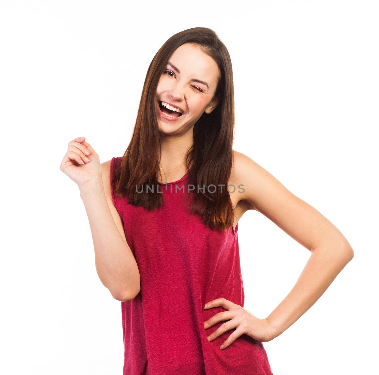Portrait of a winking young woman, isolated on white