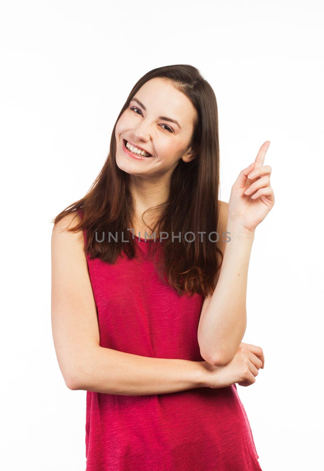Smiling woman pointing at copy space, isolated on white