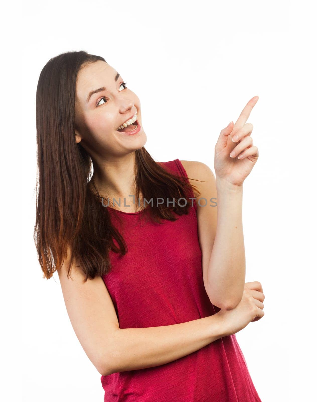 Happy woman pointing at copy space, isolated on white