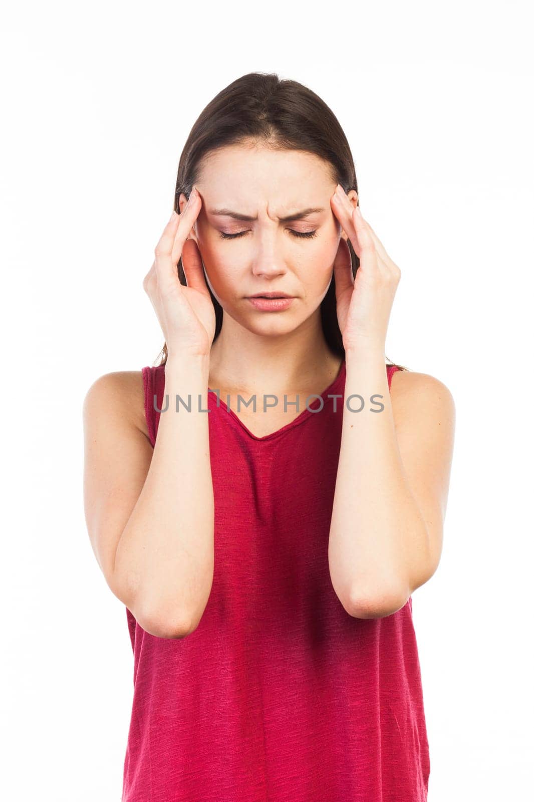 Portrait of a beautiful woman having a headache or looking stressed, isolated on white