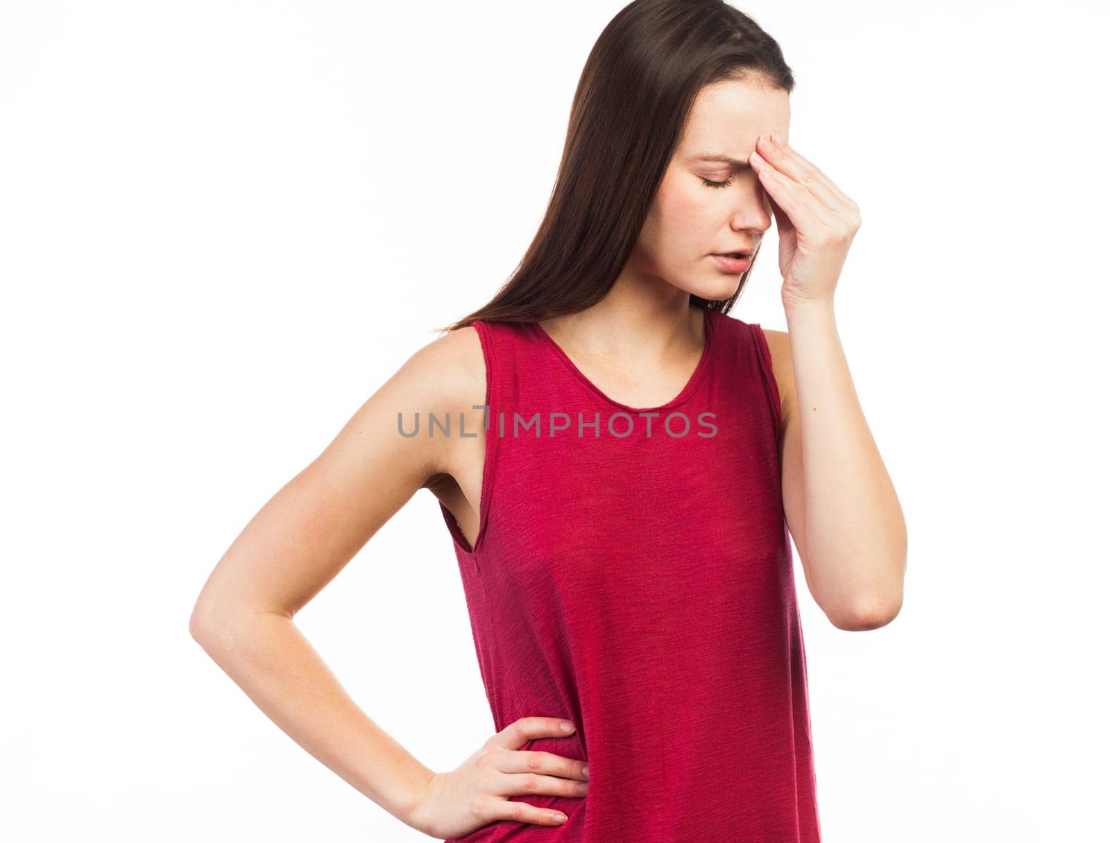 Portrait of a beautiful woman having a headache or looking stressed, isolated on white