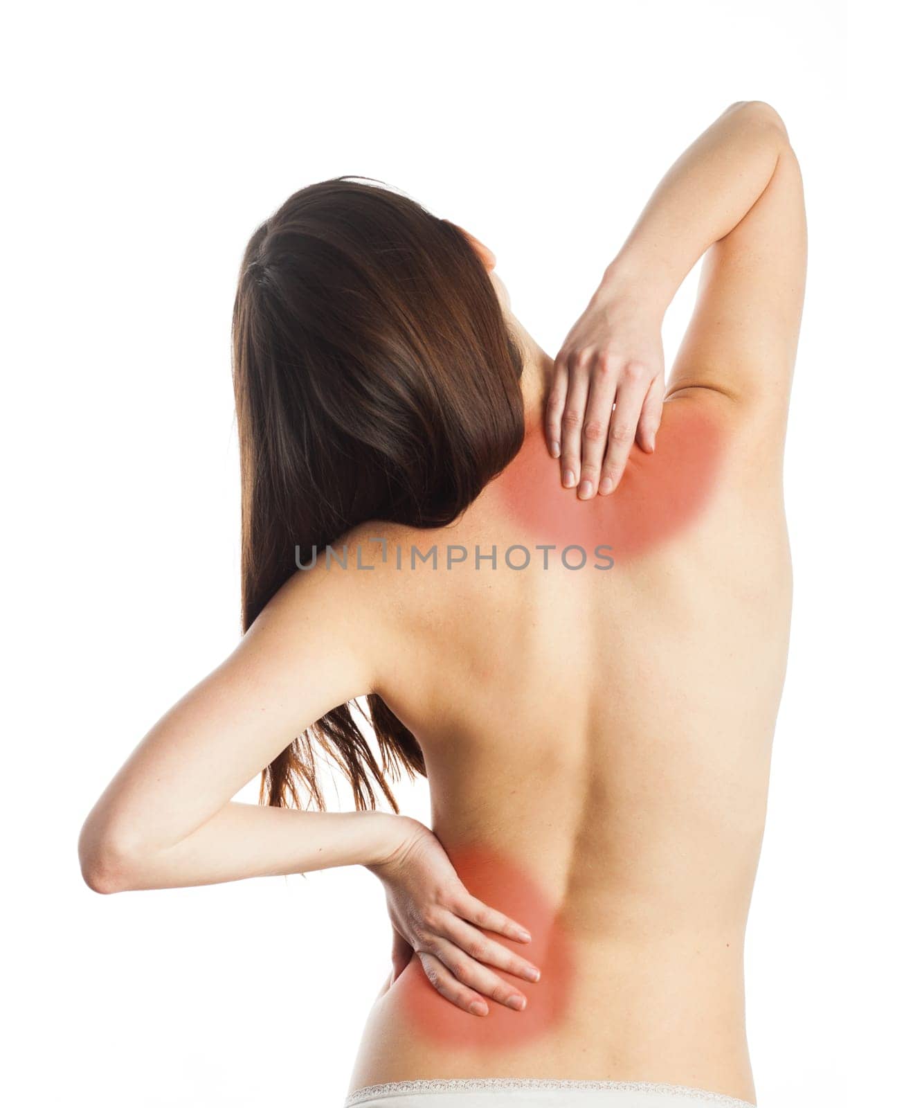 Young woman touching her back in pain, isolated on white