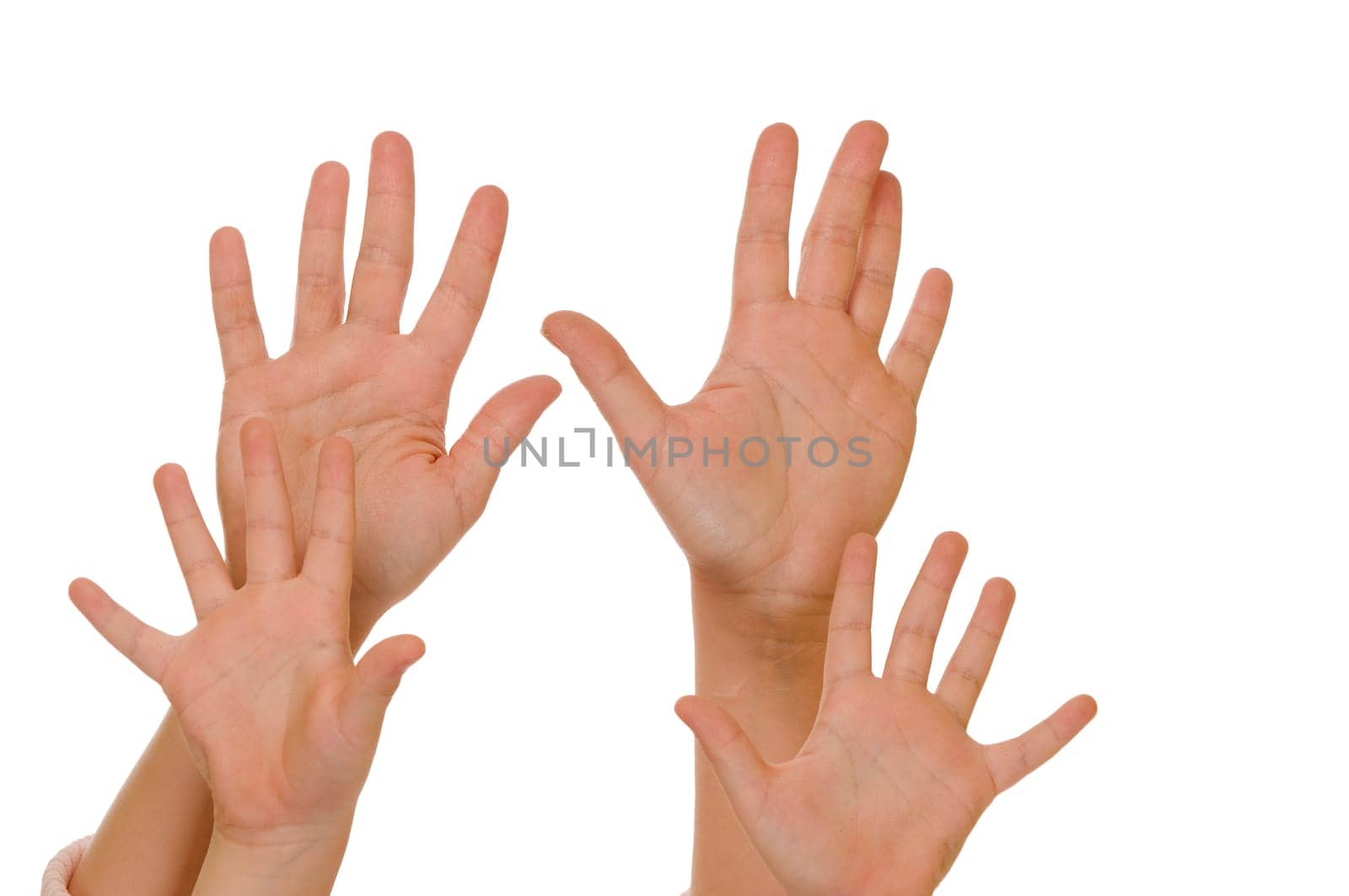 Two pairs of hands held up against a white background.