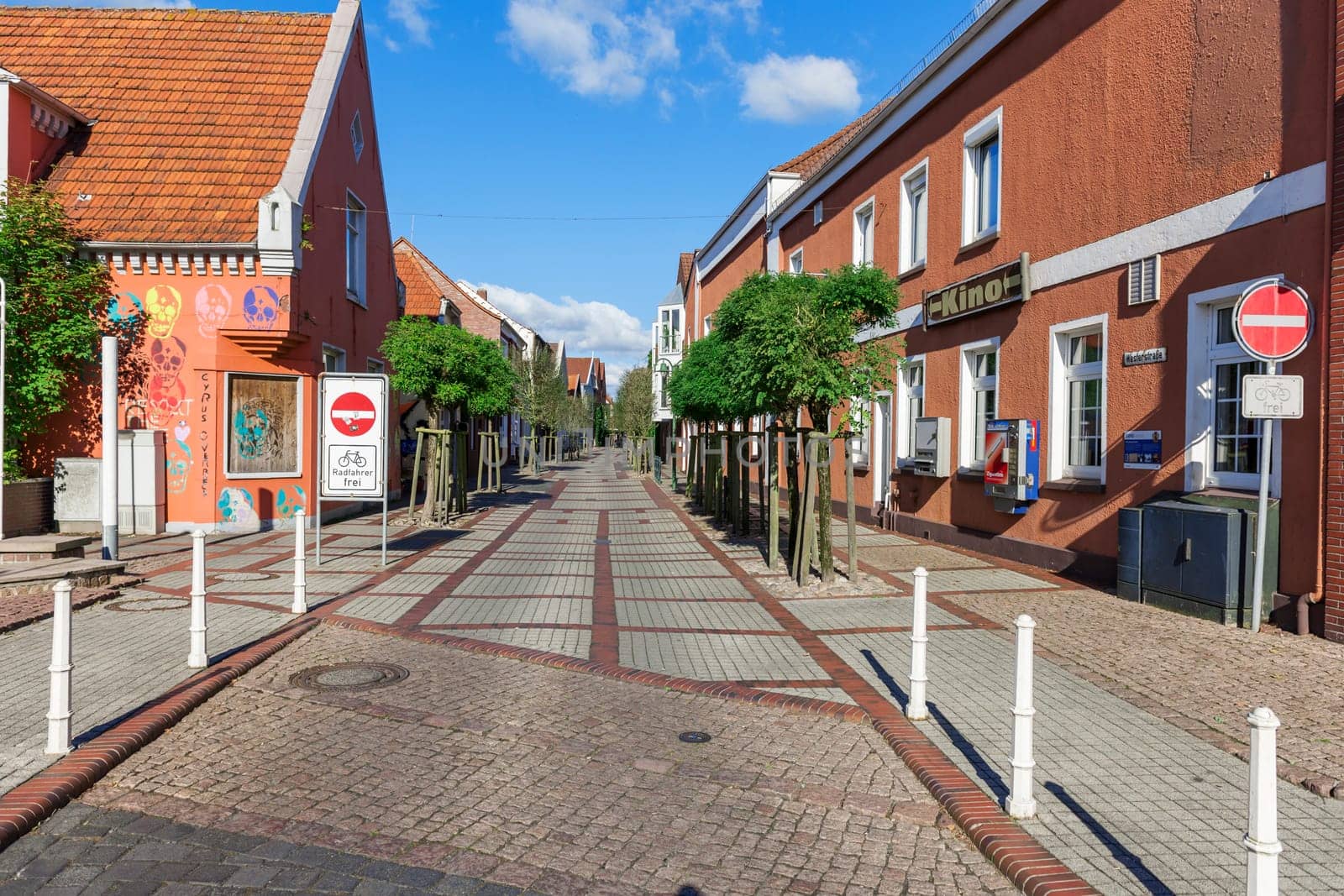 Esens,Germany - October 05,2016: View into the deserted Westerstraße in the city of Esens with typical North German buildings in good autumn weather.