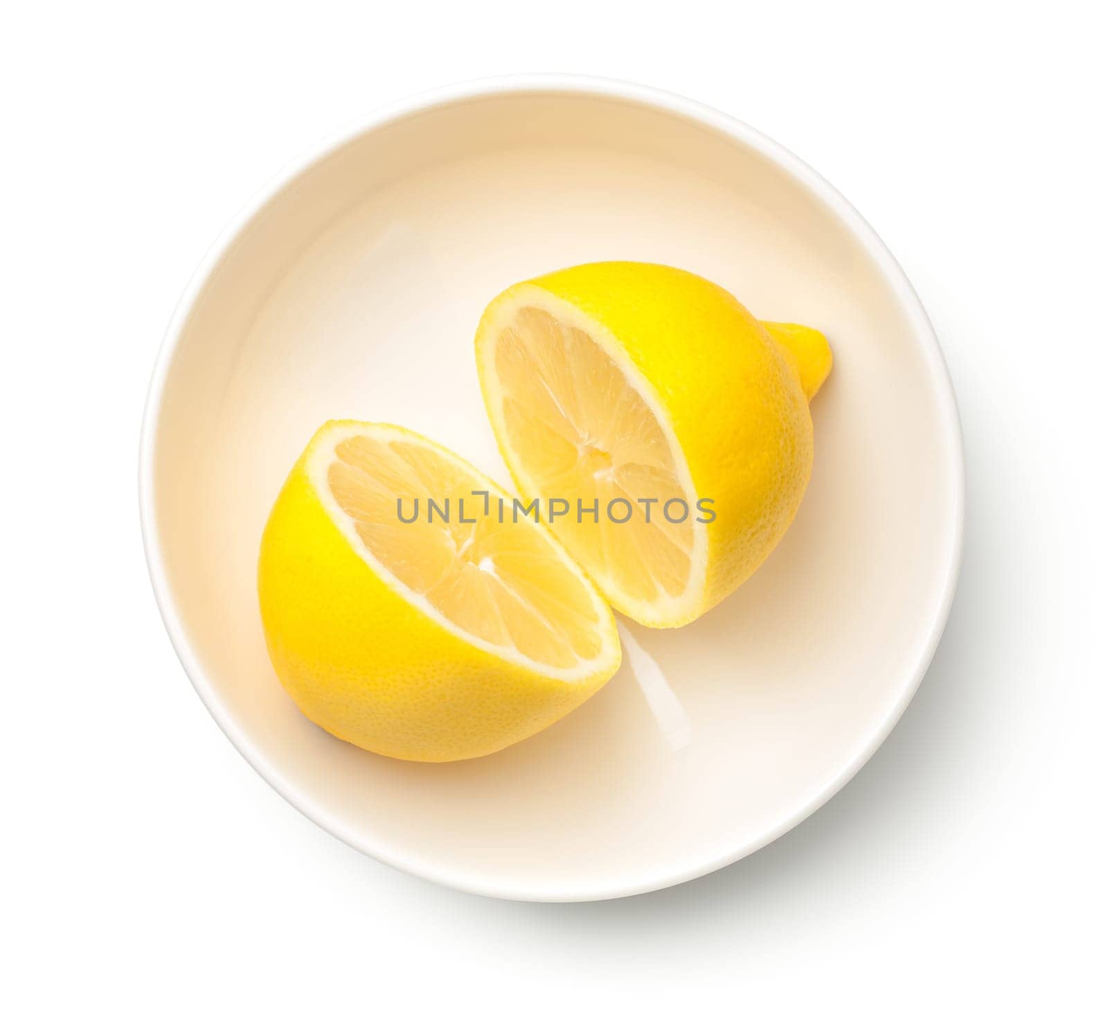 lemon in bowl isolated on white background. top view
