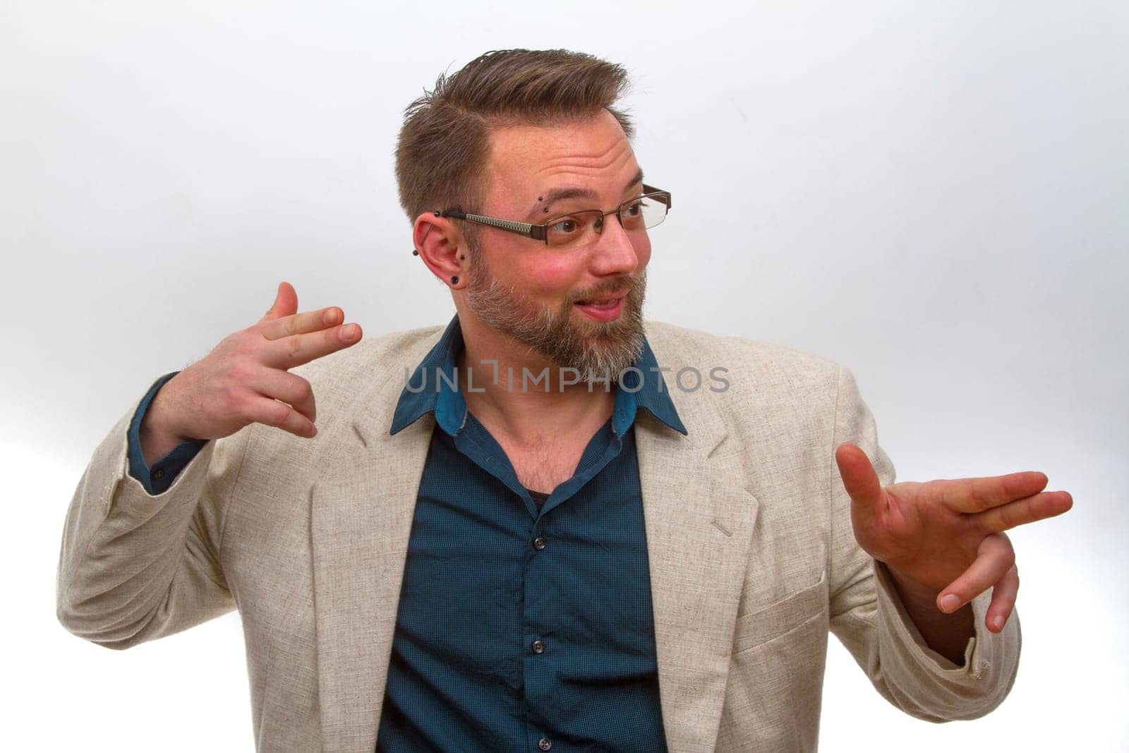 Young man points with finger on a bright background