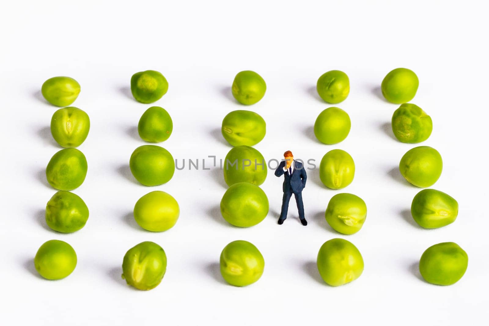 Figure of a businessman with fresh peas