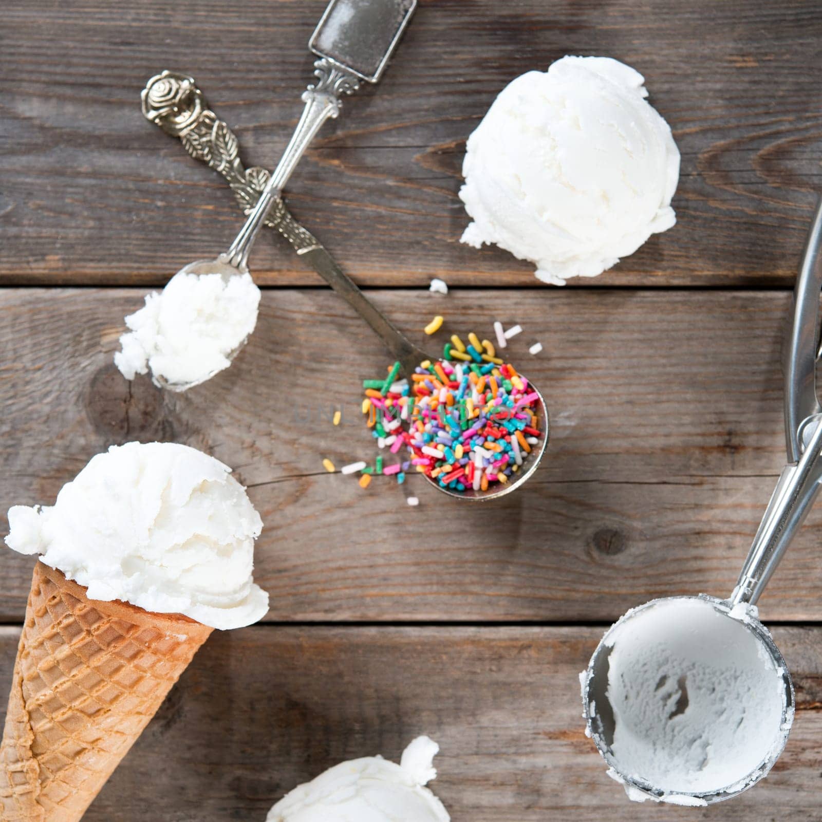 Top view yoghurt ice cream wafer cone on rustic wooden background.