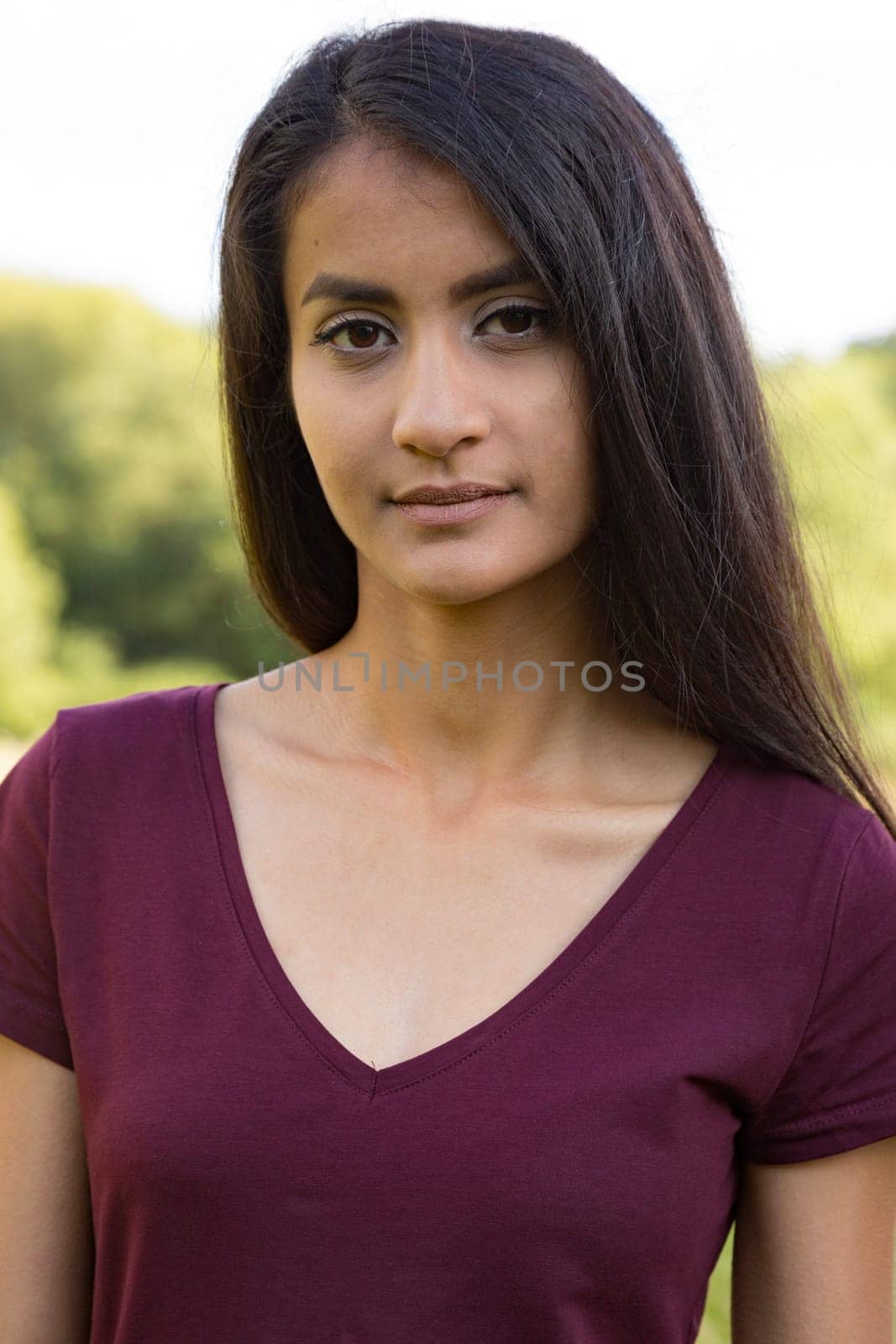 Portrait of a young woman with long black hair