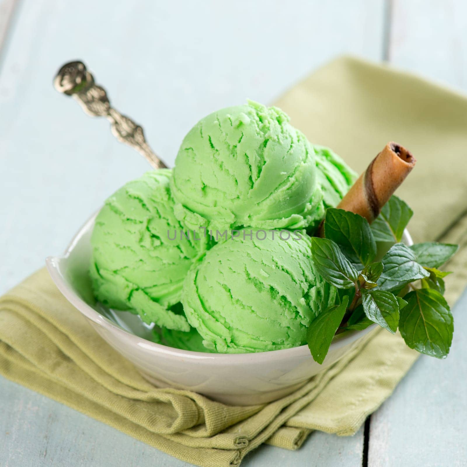 Mint ice cream on wooden background.