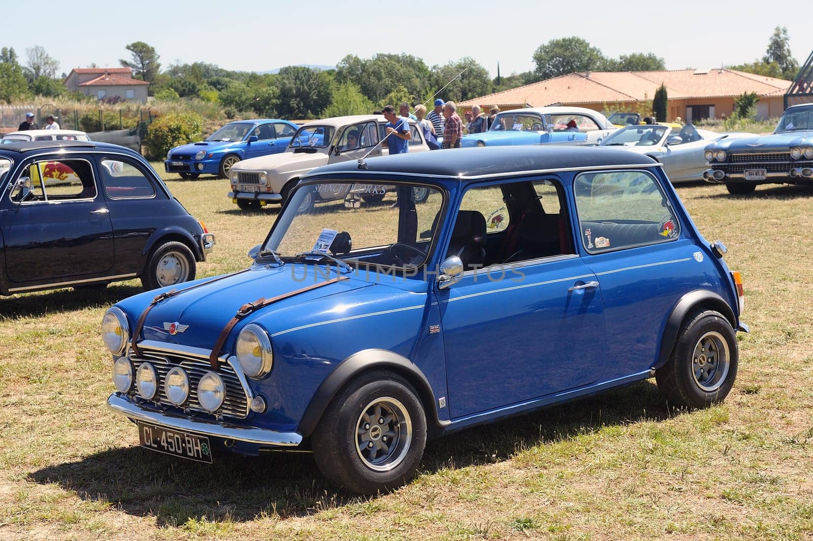 An Austin mini display in a vintage car rally