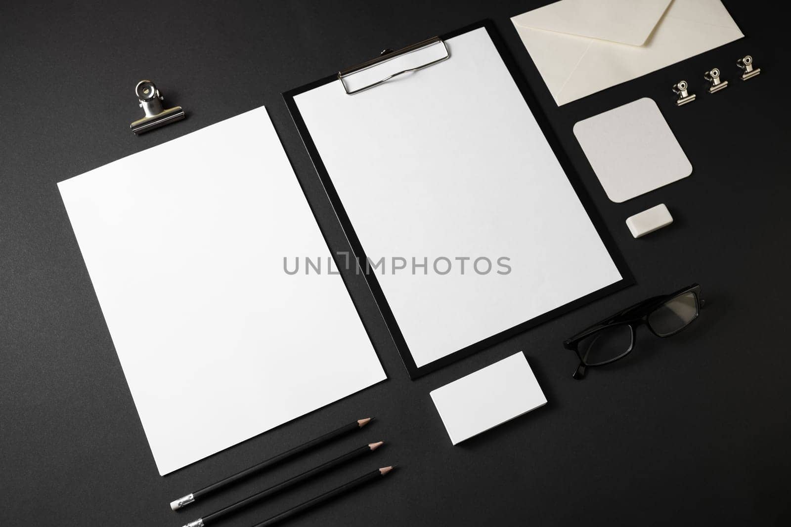 Blank stationery set on black paper background. Template for branding identity.