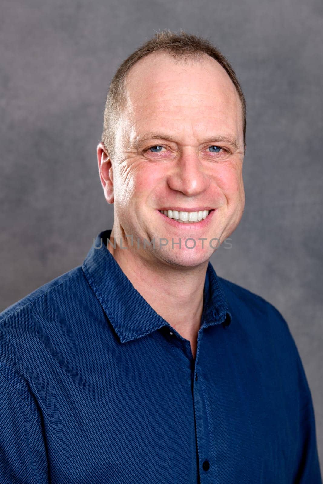 friendly young man smiling in to the camera