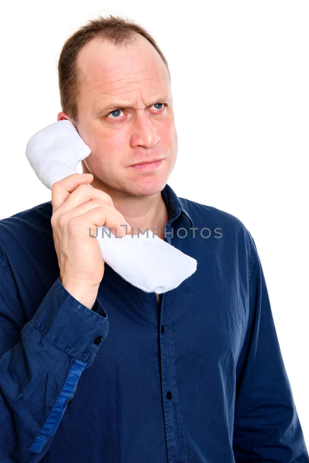 business man calling with big phone and looking grimly