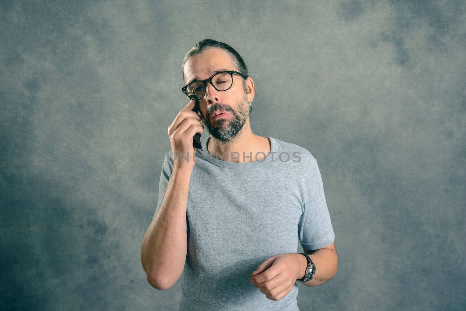 young bearded man has foreign bodies  in his eye