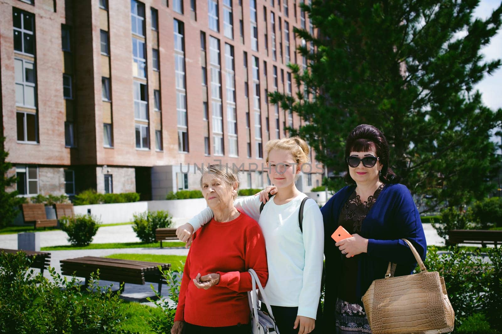 three women of different ages, family. grandmother, mother, daughter.