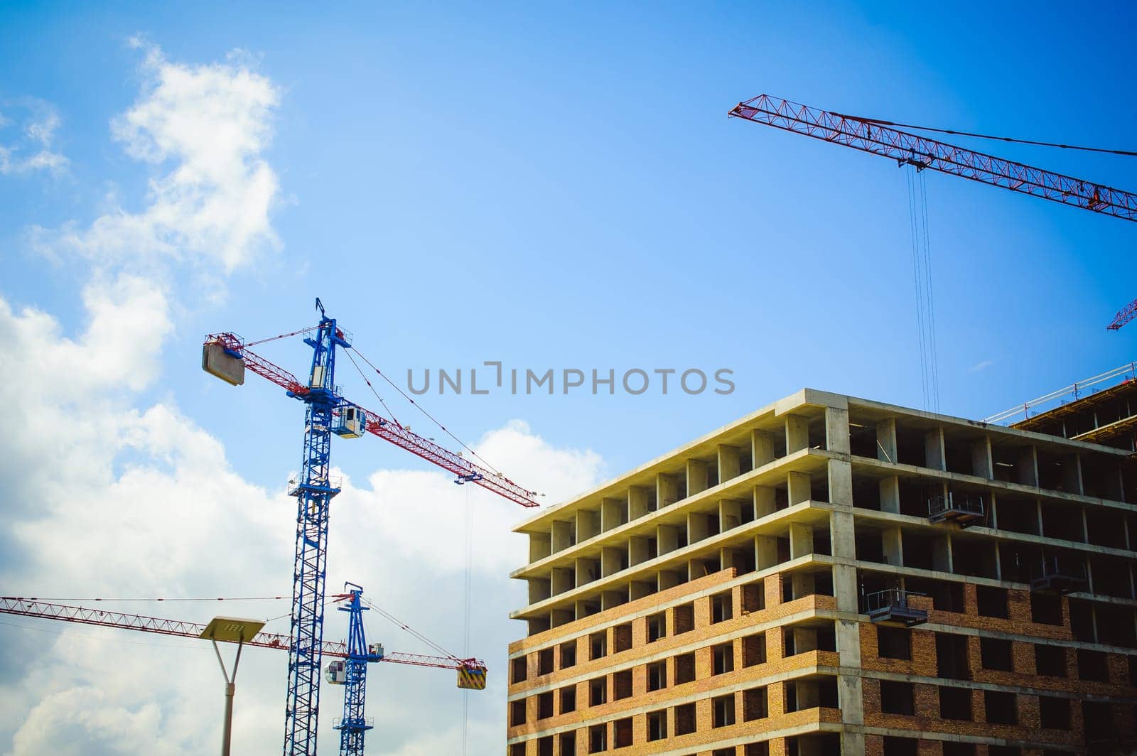 pair of cranes at the construction site