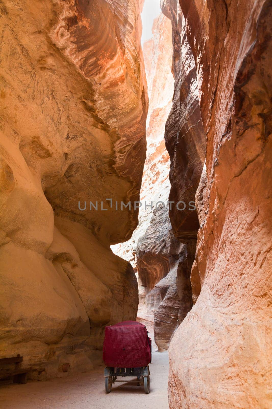 The Siq - stone gallery in a horse carriage to the hidden city of Petra, Jordan. UNESCO World Heritage Site