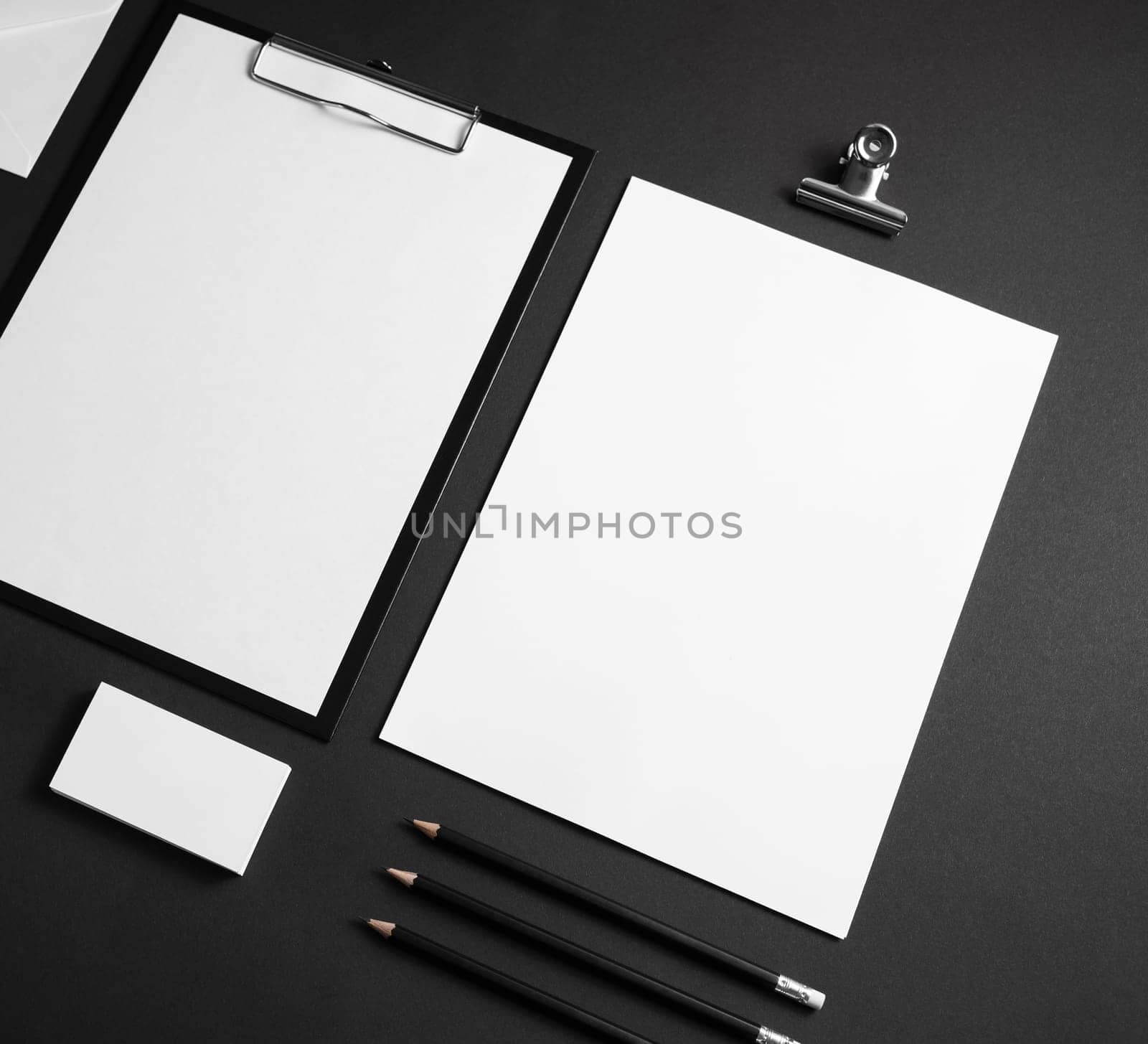 Blank stationery set on black paper background. Corporate identity template. ID mockup. Mock up for branding identity. Responsive design mockup.