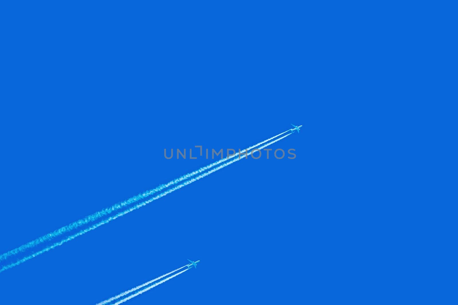 Two Jet Airplanes in the Blue Sky