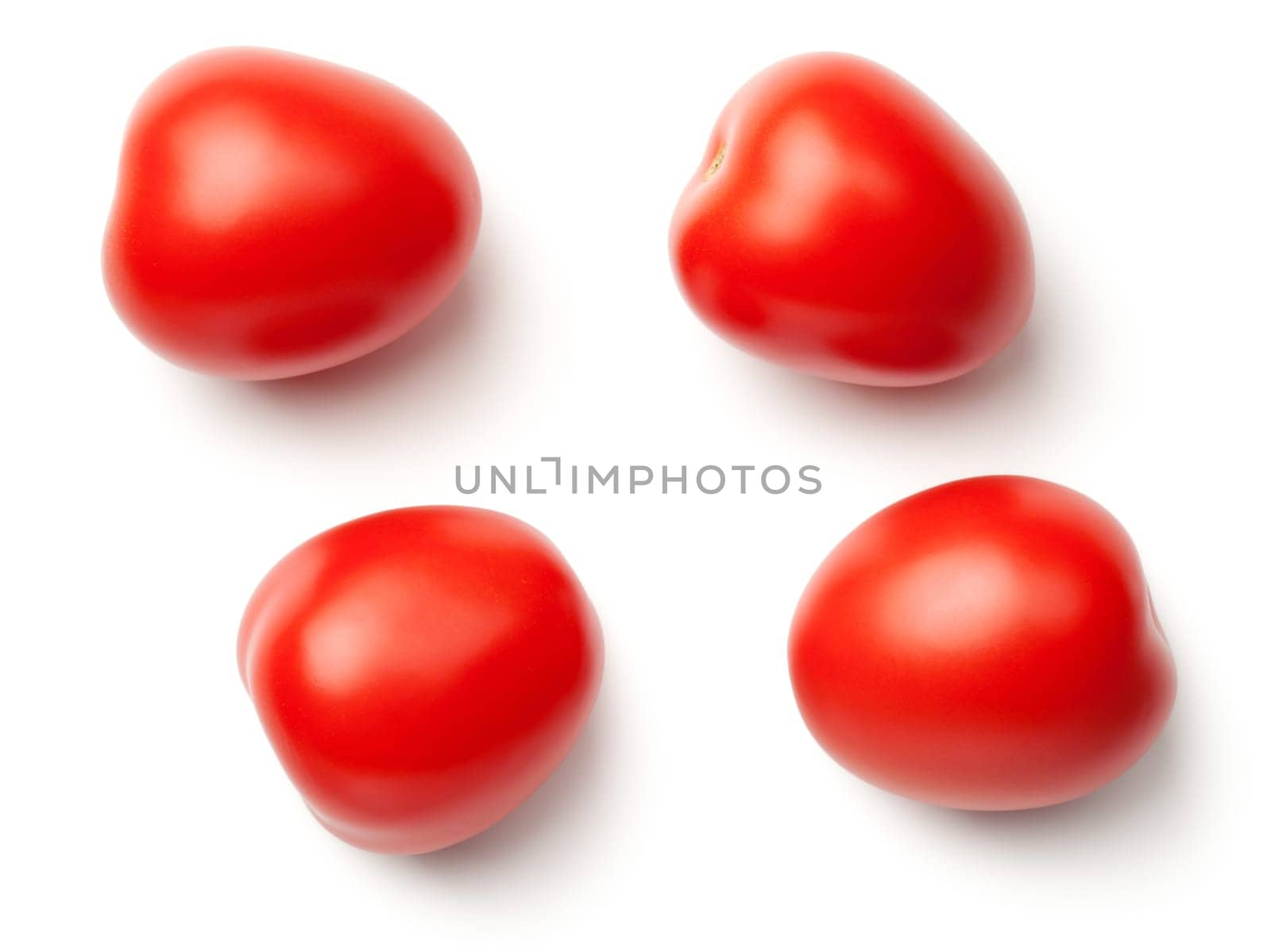 plum tomatoes isolated on white background with natural shadow. top view