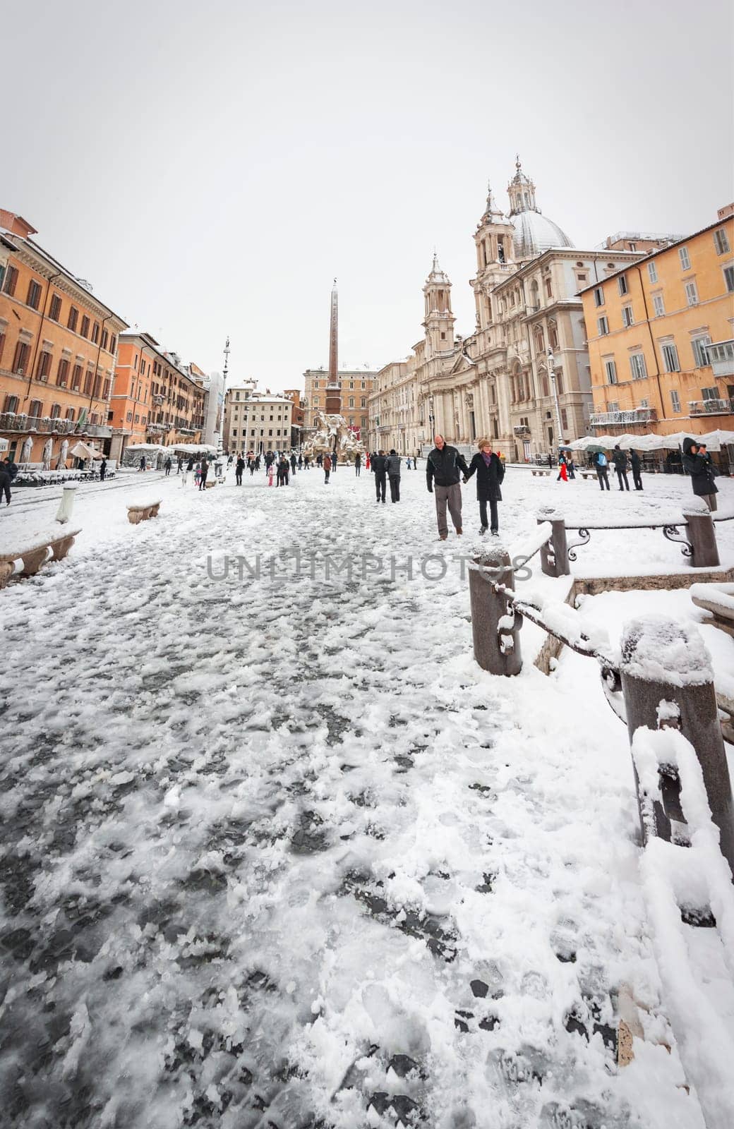 Rome, Italy, february 26th, 2018: Piazza Navona in Rome covered with snow with citizens and tourists walking in wonder after the unusual snowfall of February 26th 2018