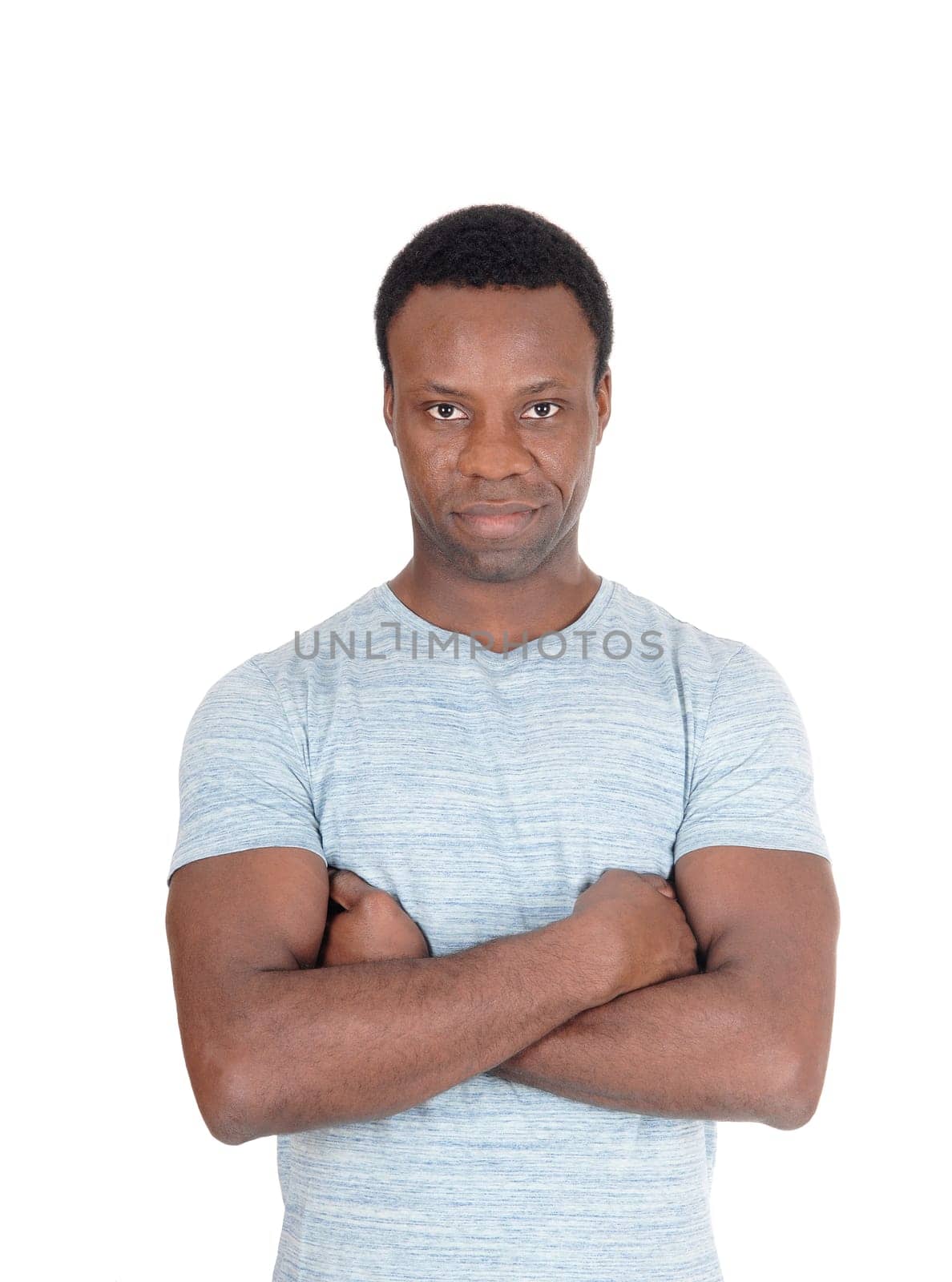 A close up image of a very serious looking African American man.standing with his arms crossed, isolated for white background.