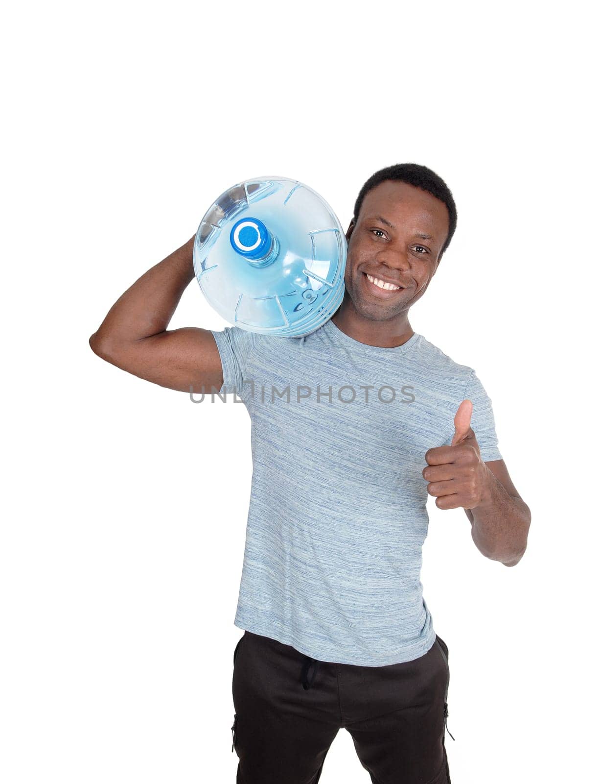 A young smiling African American man carrying a blue big water bottle.on his shoulder with thump up, isolated for white background.