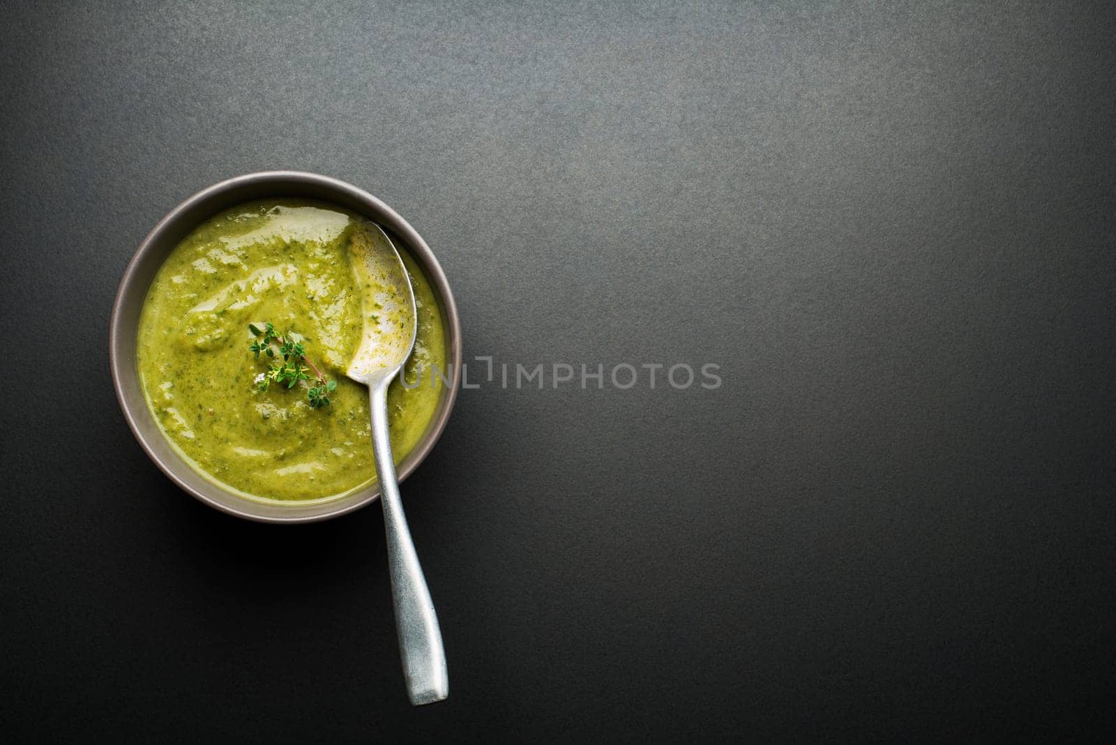 Fresh healthy vegetable green soup overhead shoot.