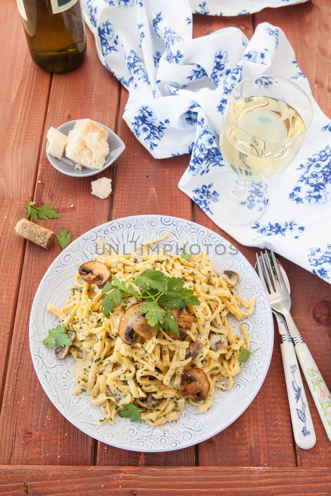 Taglietelle noodles with mushrooms and cream vinegar