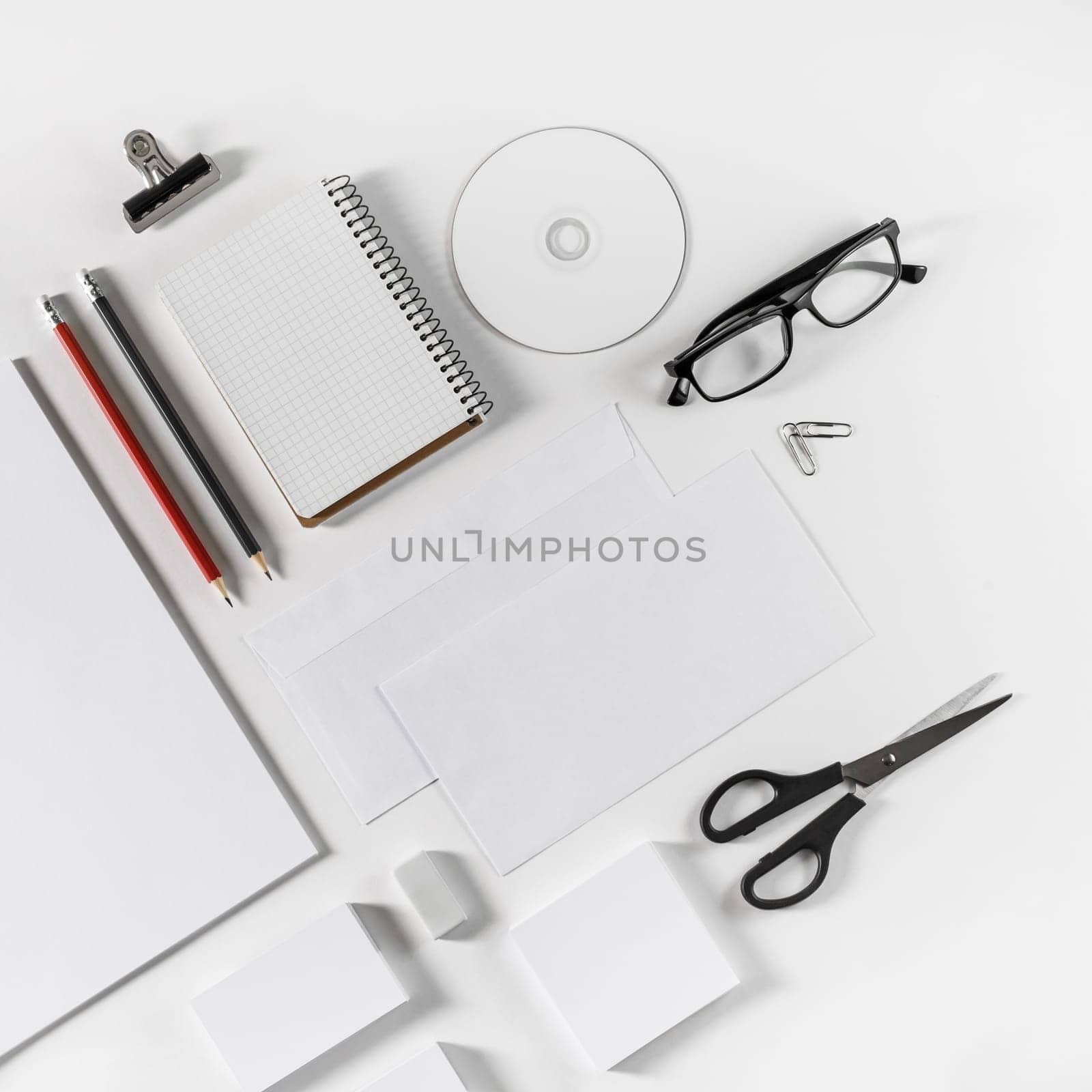 Brand identity template. Photo of blank corporate stationery set on white paper background.