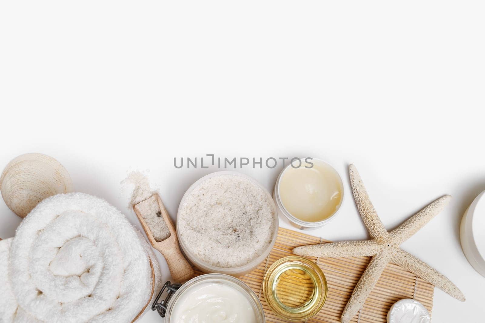Spa and wellness products on white paper background. Top view with copyspace for your text. Flat lay.