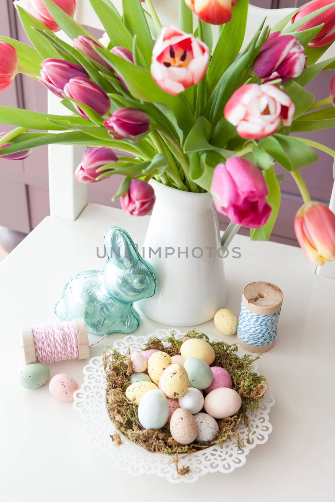 Small Easter nest and fresh tulips