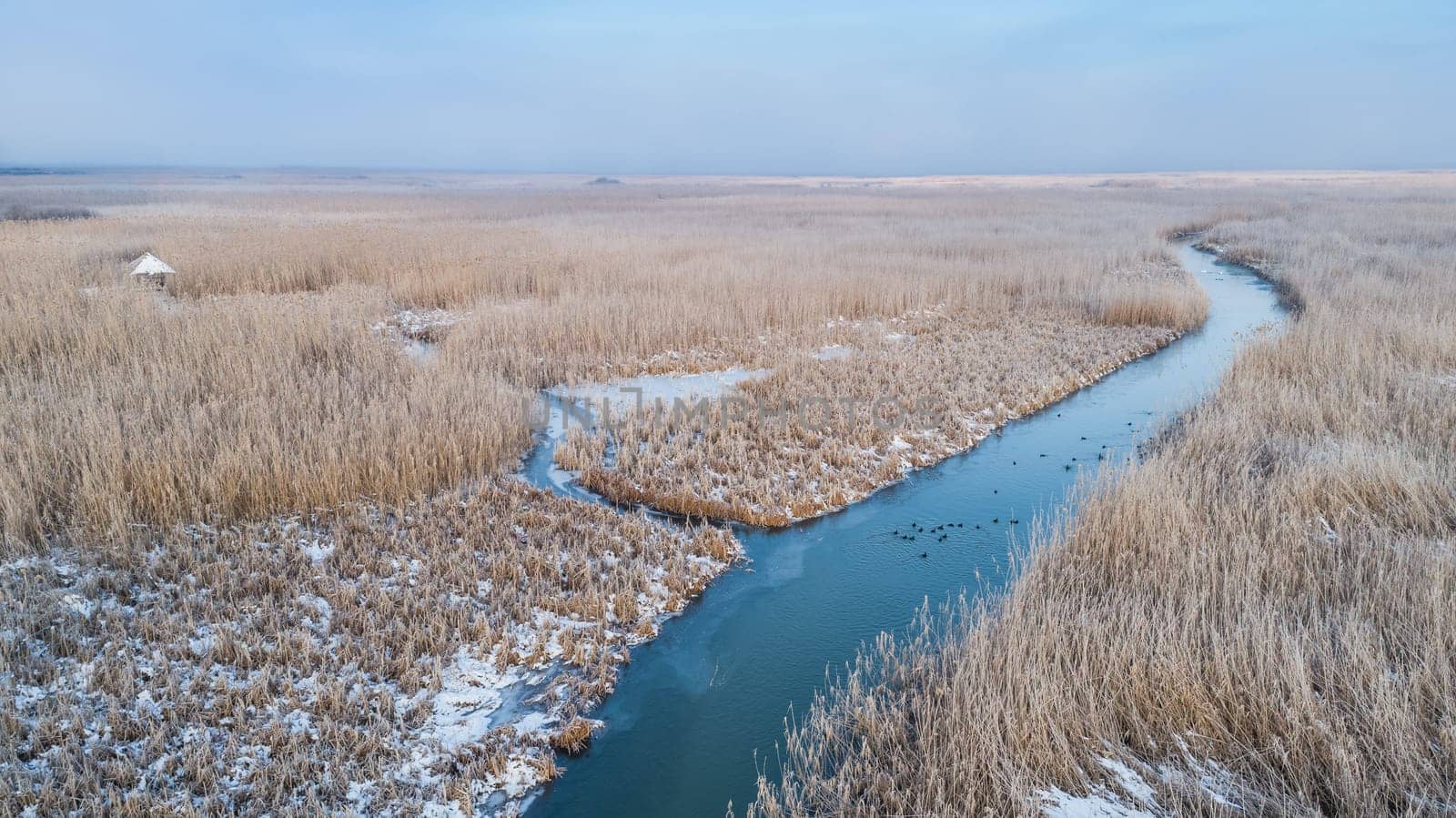 lake in winter. Location: Comana Natural Park, Romania. Aerial view