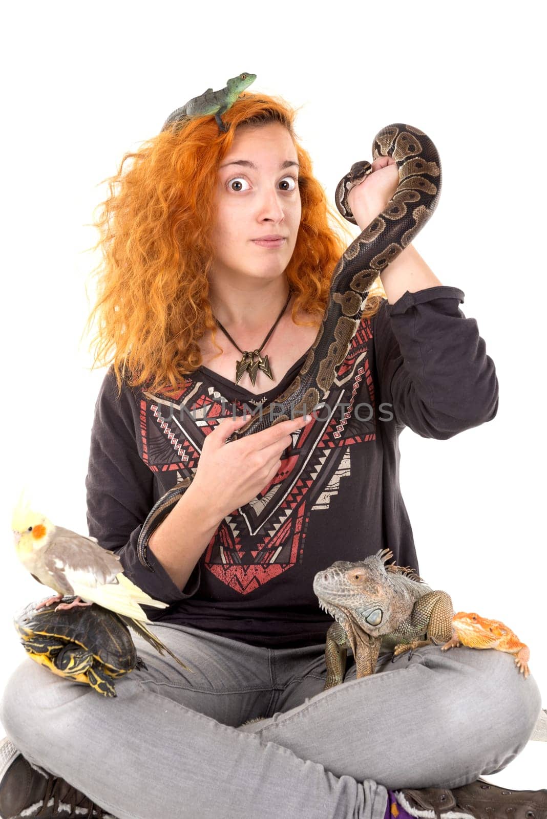 Girl with several pet animals isolated in white