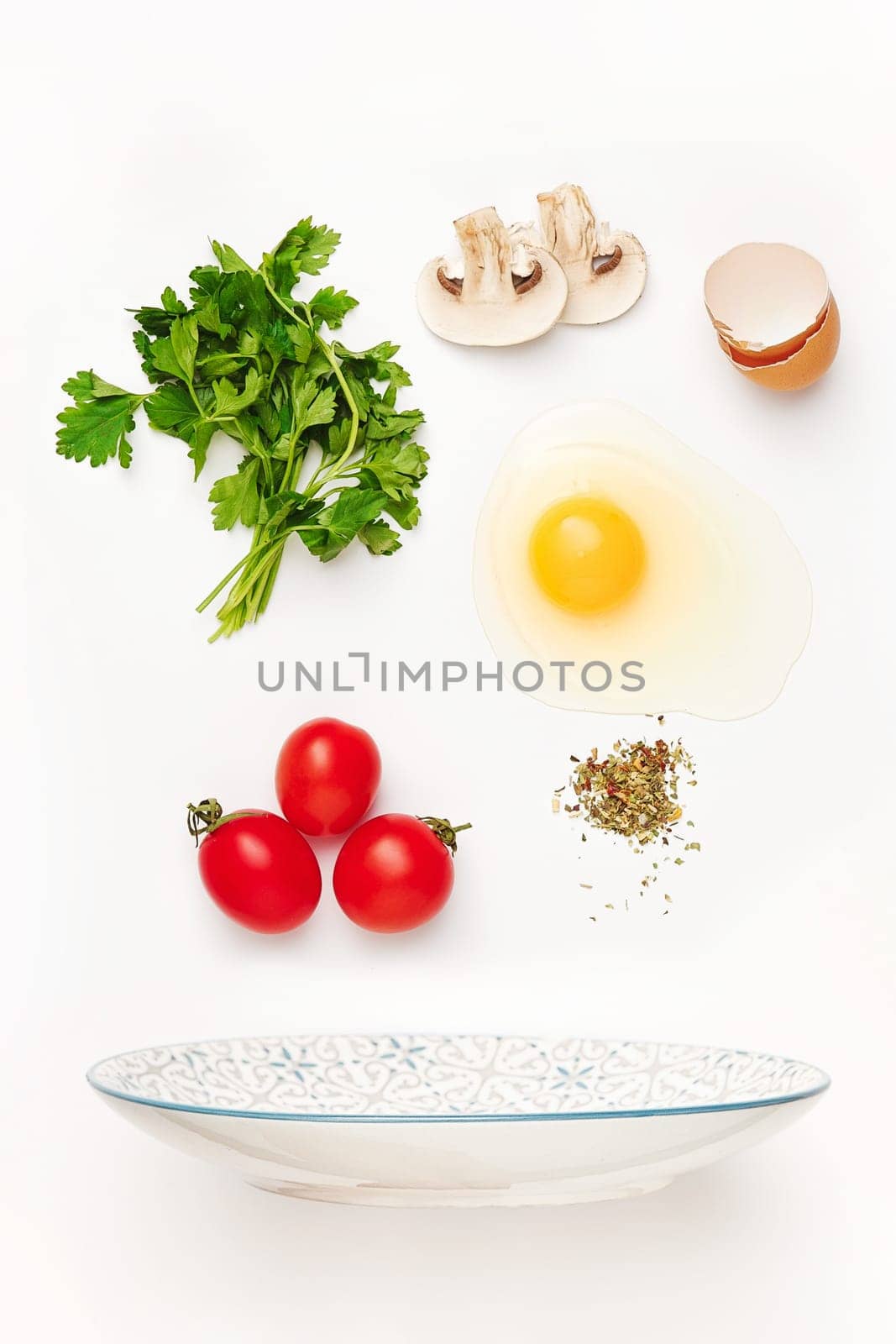 The falling ingredients of fried egg. Healthy breakfast ingredients. Flying food