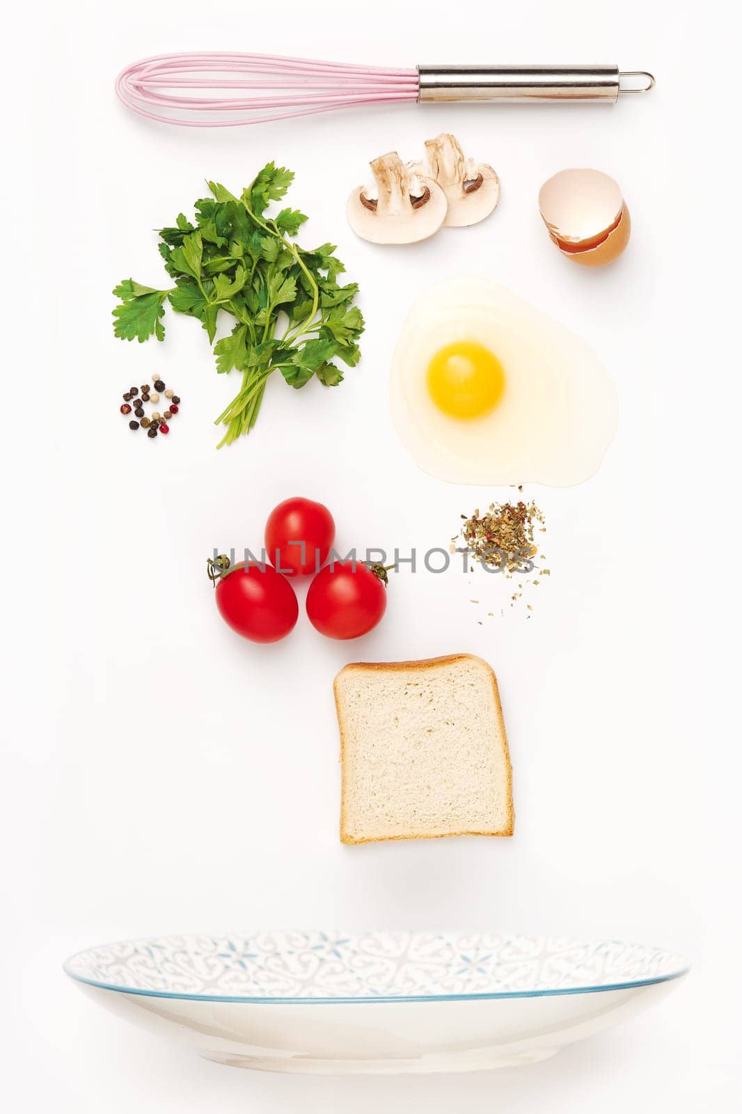 The falling ingredients of fried egg. Healthy breakfast ingredients. Flying food