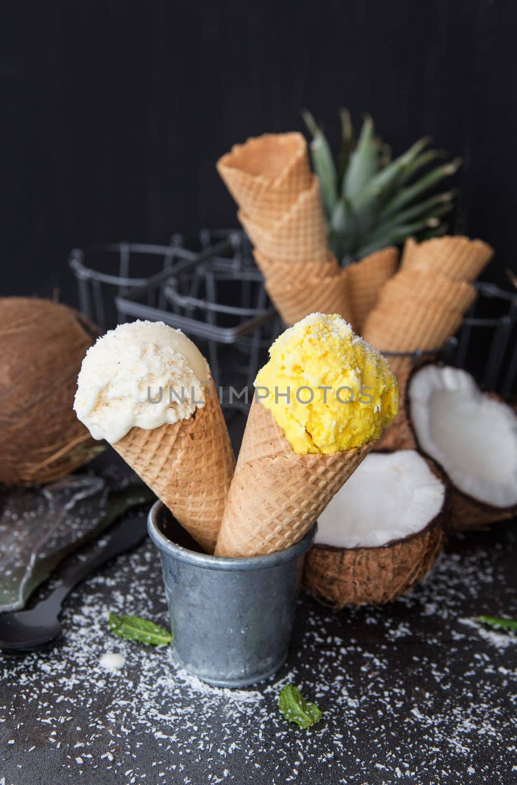 Vanilla and mango ice cream in waffle tukes