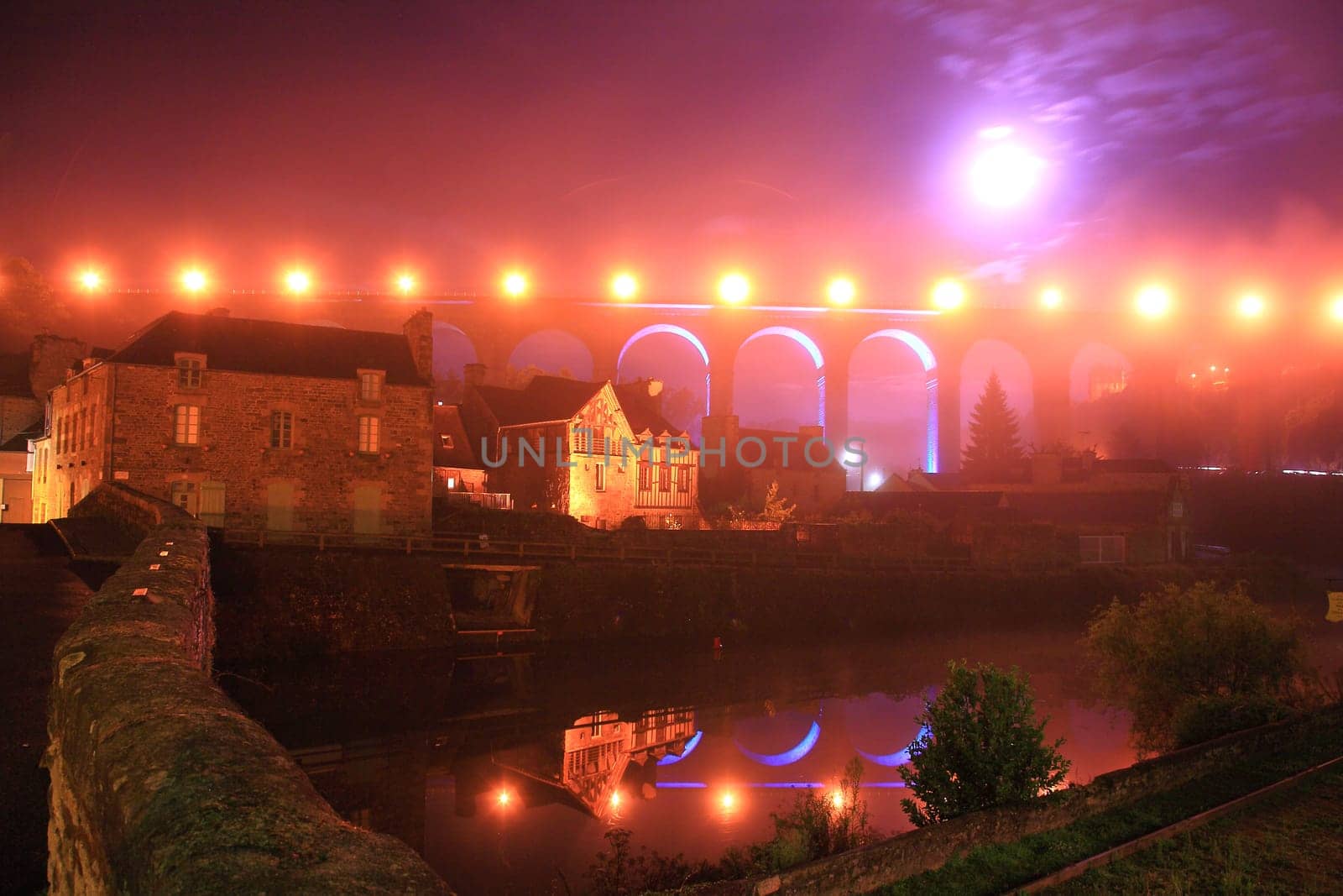 Night view of Dinan, medieval town on the Rance river. Dinan, Brittany, France.