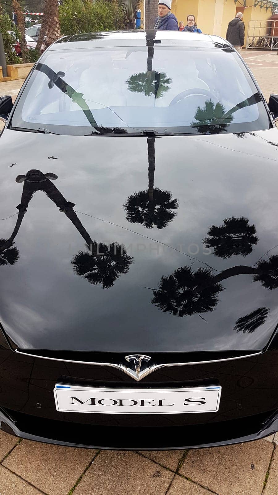 Menton, France - March 3, 2018: Black Tesla Model S (Front View) Electric Car Parked on a Square in Menton on The French Riviera. The Tesla Model S is a Luxury Full-Sized Electric Five Door