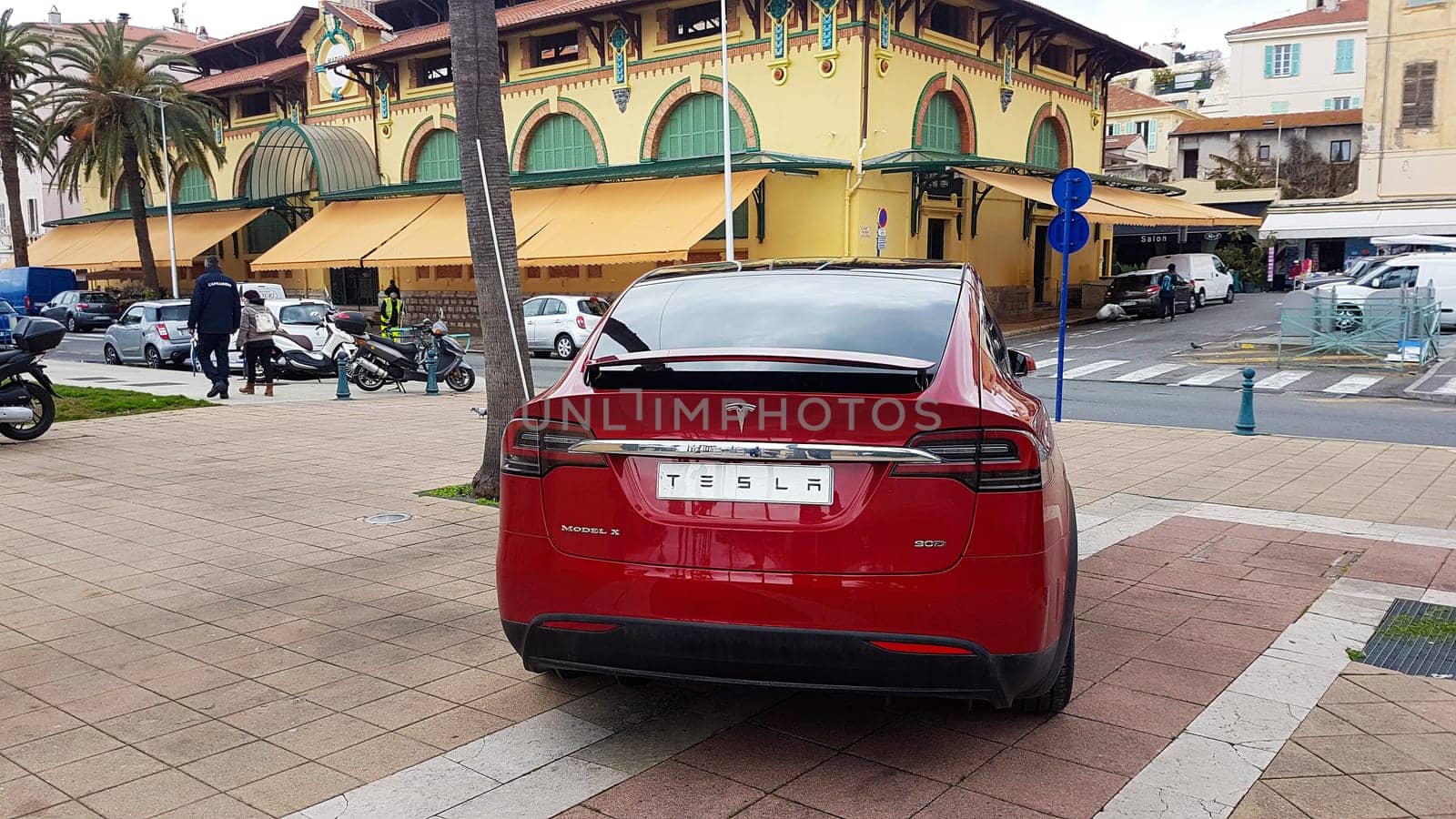Menton, France - March 3, 2018: Red Tesla Model X (Rear View) Electric Car Parked on a Square in Menton on The French Riviera. Tesla Model X is a Luxury Full-Sized SUV, All-Electric Crossover