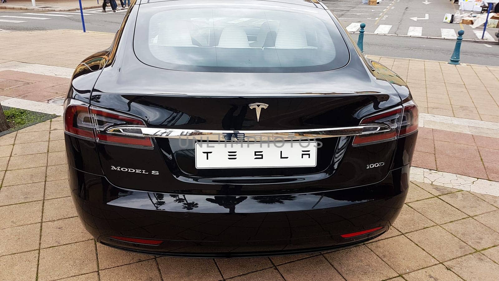 Menton, France - March 3, 2018: Black Tesla Model S (Rear View) Electric Car Parked on a Square in Menton on The French Riviera. The Tesla Model S is a Luxury Full-Sized Electric Five Door .