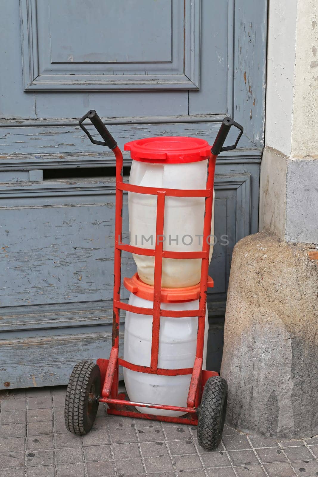 Two Plastic Barrels at Dolly Transport Delivery
